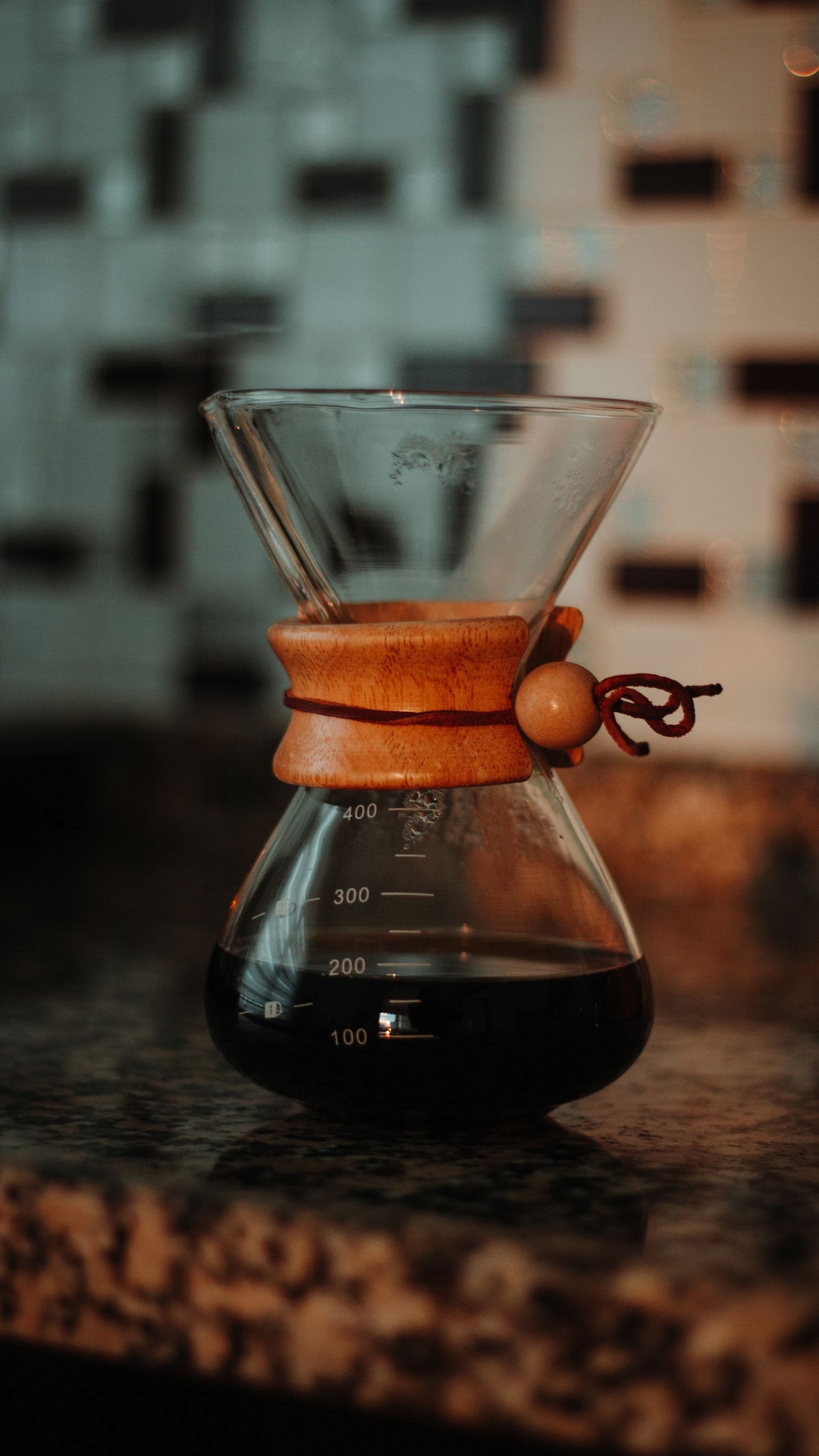 Stock lifestyle photo, not the actual product: glass coffee server on a stone counter, shown for Hario Server 800ml