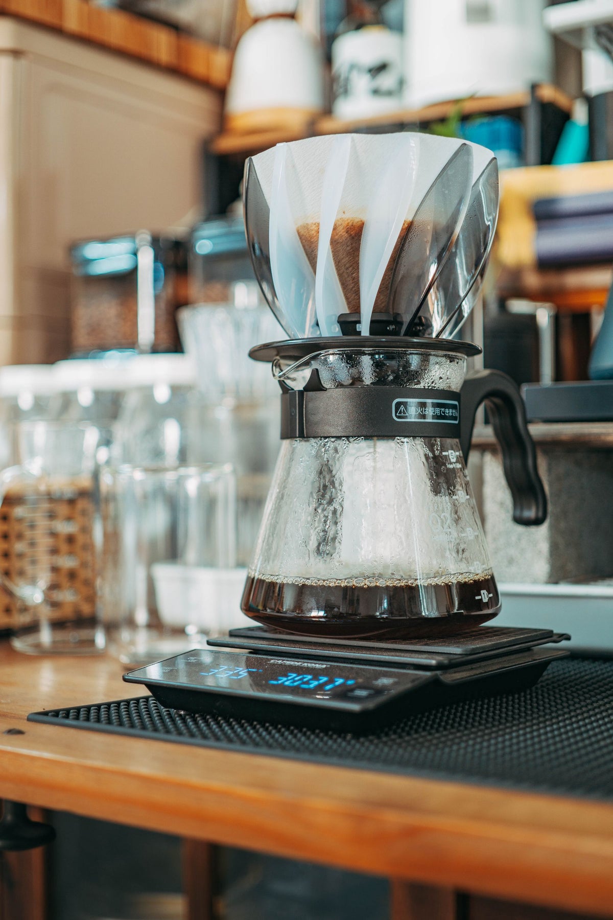Stock lifestyle photo, not the actual product: drip coffee setup on a digital scale, shown for Breville Precision Coffee Brewer – Thermal